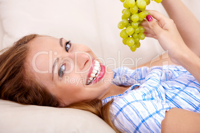 Happy women with grapes