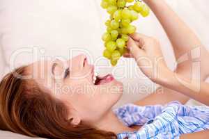 pretty girl with green grapes