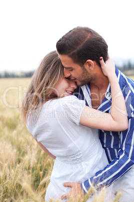 Portrait of a young Couple hugging and kissing