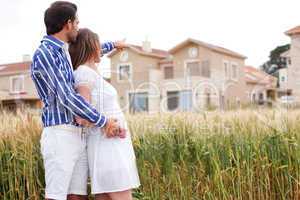 Young romantic couple standing together