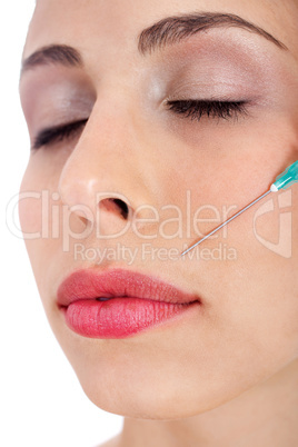 Close up of a pretty woman getting Botox injection