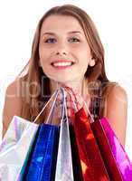 Woman holding lots of shopping bags in her hand