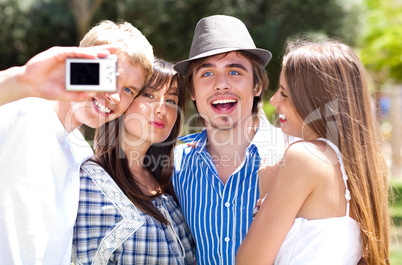 Group of College students standing together taking a self portrait