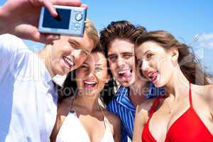 Group of young friends standing together taking a self portrait