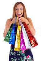 Happy woman holding lots of shopping bags in her hand