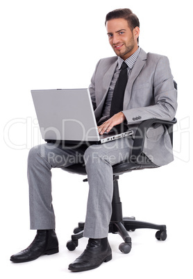 Business man sitting with laptop and smiling