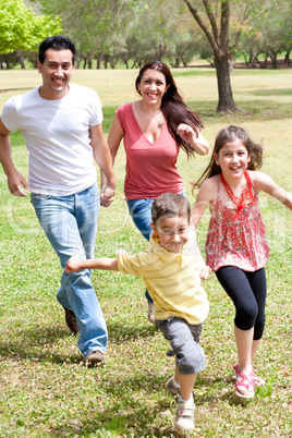 Family playing in the green field