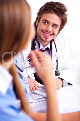 Smiling male doctor looking the side cornor