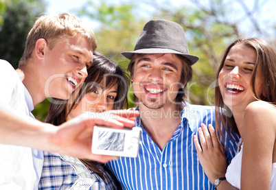 group of happy smiling couples taking picture together