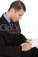 Closeup of a business man writing down