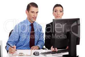 Business women pointing something on their computer