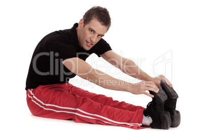Fitness men stretches his leg