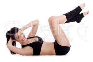 Fitness instructor doing situp exercise and turning to camera