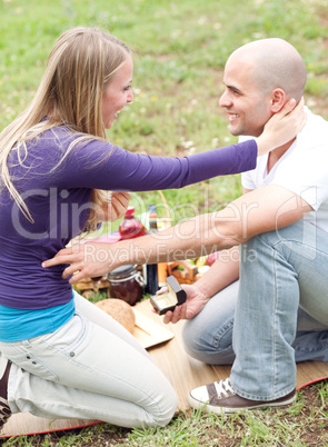 Man presenting a gift to her girlfriend