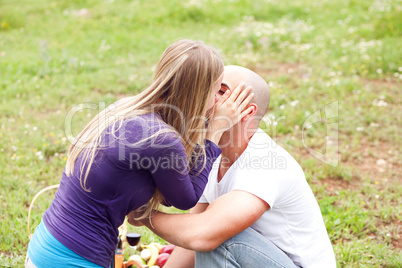 An attractive couple sharing a passionate kiss