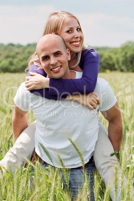 Man piggybacking her girlfriend