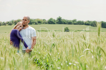 Shot of young couple hugging and holding hands