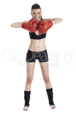 Female boxer looking very focused with red gloves