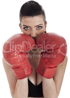 Woman covering her mouth with red gloves
