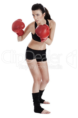 Woman boxer ready to punch the opponent in boxing