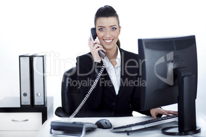 Smiling woman busy over phone Smiling woman busy over phone