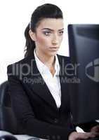 Serious business woman working in computer