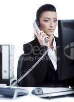 Young business woman making a phone call at office