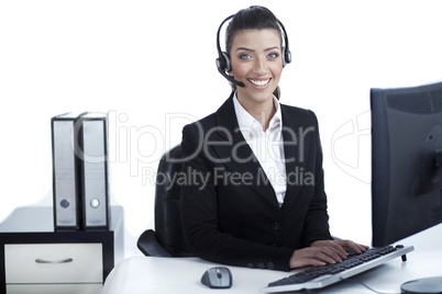 Pretty business woman working at office wearing headset