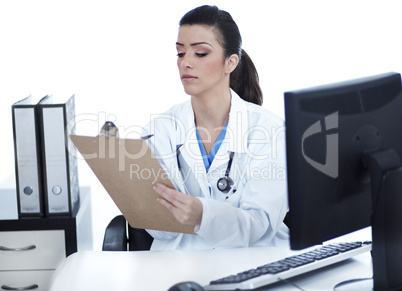 Doctor woman sitting on her office making notes
