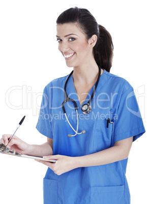 Smiling cute nurse making her medical notes