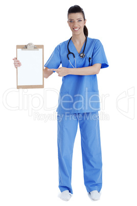 Full length of young nurse pointing blank clipboard