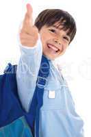 Smiling kinder garden boy gives thumbs up