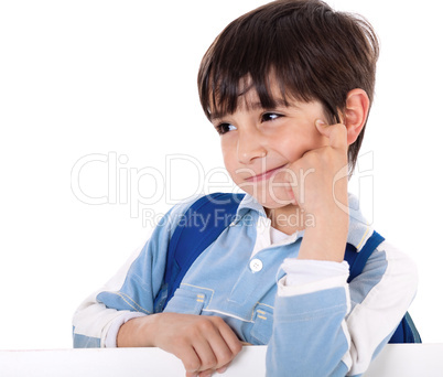 Portrait of a adorable school boy thinking