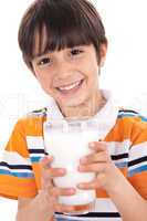 Happy kid holding a glass of milk