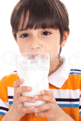 Happy kid drinking glass of milk