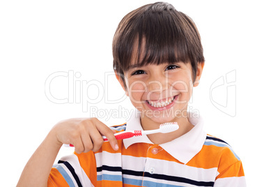 Closeup of cute kid brushing his teeth