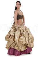 Beautiful blond belly dancer in golden costume dancing