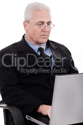 Mature business man busy working in notebook