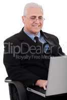 Mature business man in working with laptop
