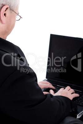 Rear view of business man working in laptop