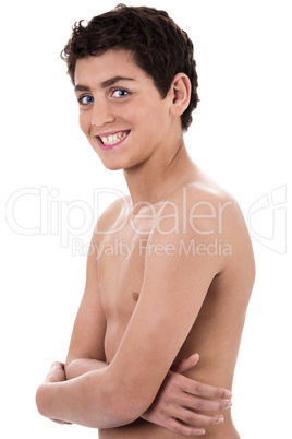 Boy giving strange expression and smiling