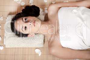 Young woman relaxing and getting ready for spa treatment
