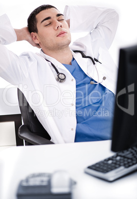 Young male doctor relaxing at his cabin