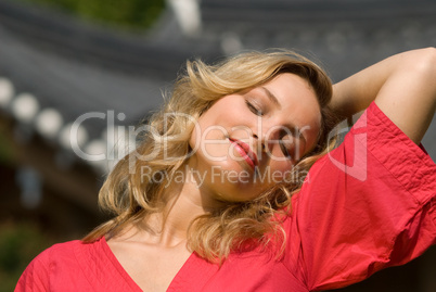 relaxed woman in red dress