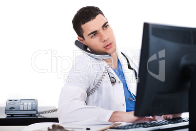 Doctor logging his notes in computer