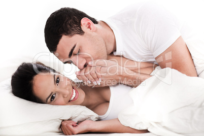 Intimate young couple in bed