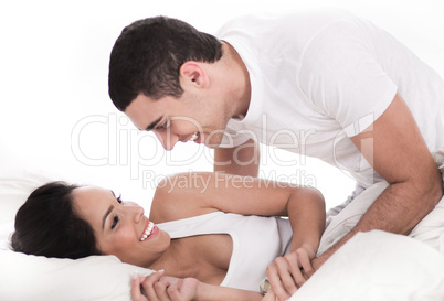 Loving affectionate couple in bed