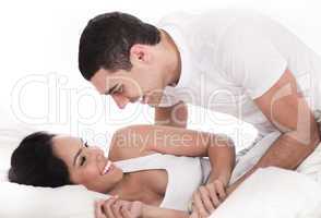 Loving affectionate couple in bed