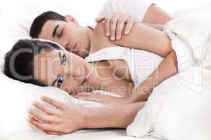 Loving embracing lying couple of woman and sleeping man