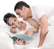 Woman reading dairy, affectionate man trying to kiss her